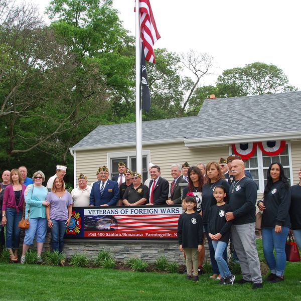 Post 400 members and families standing outside the renovated Post building